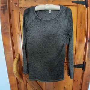 Long Sleeved Flowy with Graphics on Shoulders.